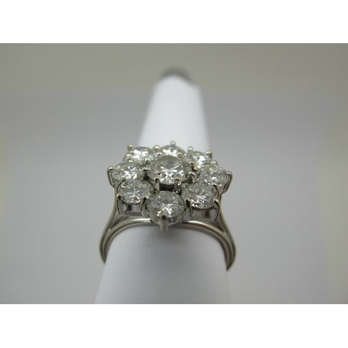 186 - A Large Nine Stone Diamond Cluster Ring, of flowerhead design, claw set with brilliant cut stones (i... 