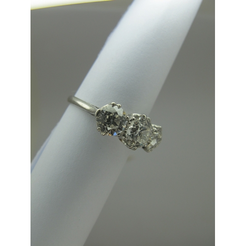 187 - A Large Three Stone Diamond Ring, the graduated old cut stones claw set, stamped 