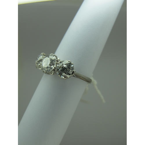 187 - A Large Three Stone Diamond Ring, the graduated old cut stones claw set, stamped 