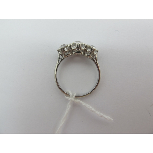 187 - A Large Three Stone Diamond Ring, the graduated old cut stones claw set, stamped 