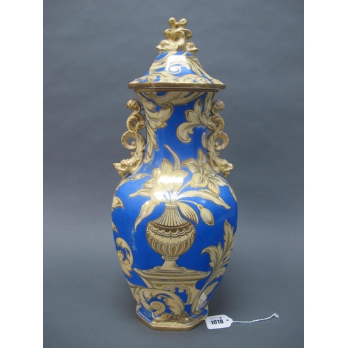 1018 - A Mid XIX Century Pottery Vase and Cover, with dolphin finial, the octagonal body with dragon handle... 