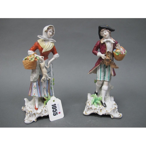 1055 - A Pair of Sitzendorf Porcelain Figures of a Lady and Gentleman, she carrying a basket and holding a ... 