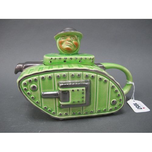 1057 - An Art Deco Pottery Teapot and Cover Modelled in the Form of a Tank, the cover with head finial, and... 