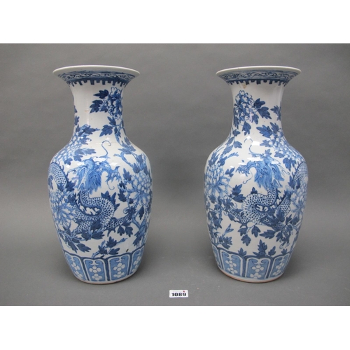 1089 - A Pair of Late XIX Century Chinese Pottery Vases, of baluster form, painted in blue with dragons ent... 