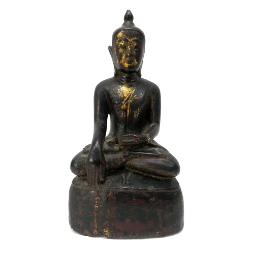 1097 - A Burmese Carved Wood Figure of Buddha Shakyamuni, possibly XVI/XVII Century, seated in dhyanasana w... 