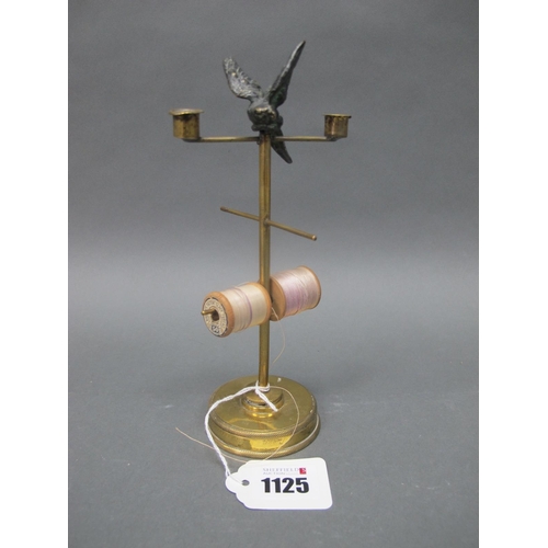 1125 - A Late XIX Century Brass Bobbin Stand, surmounted by a speltre bird with two taperstick holders and ... 