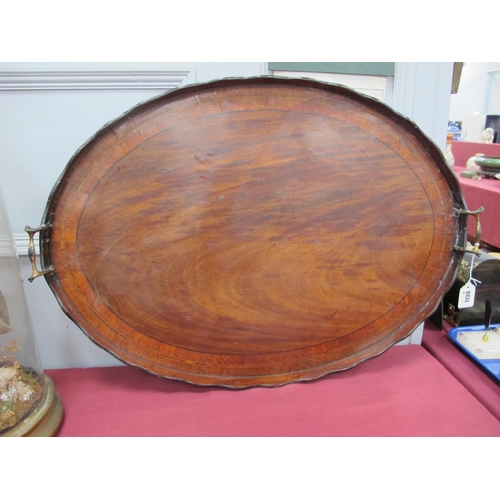 1130 - An Early XX Century Mahogany Oval Twin Handled Tray, with crossbanding and shaped gallery.