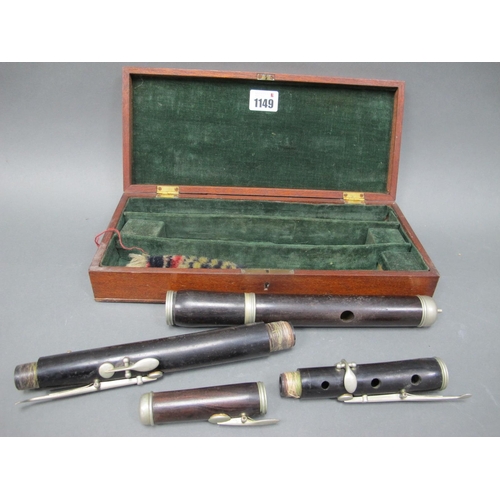 1149 - An Early XX Century Rosewood Flute, with white metal keys and mounts, in original fitted wood case,