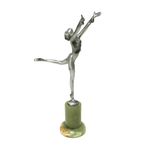 1152 - A Lorenzl Art Deco Silvered Metal Figure of a Dancer, standing on one leg, her arms outstretched, ra... 