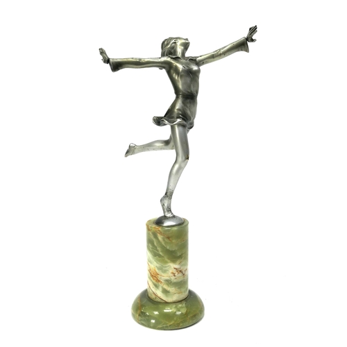 1159 - A Lorenzl Art Deco Silvered Metal Figure of a Dancer, standing on one leg, her arms outstretched, ra... 