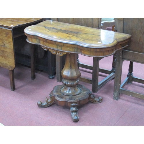 1482 - A XIX Century Rosewood Tea Table, with a shaped fold over top and shaped base on scroll feet, 94cm w... 