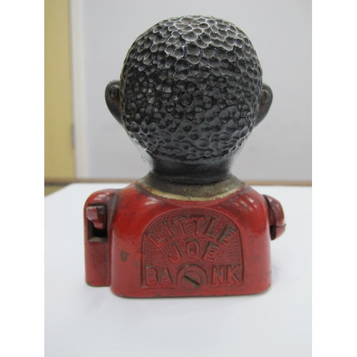 1121 - A Late XIX Century 'Little Joe Bank' Cast Iron Money Box, with painted decoration, 13cm high.