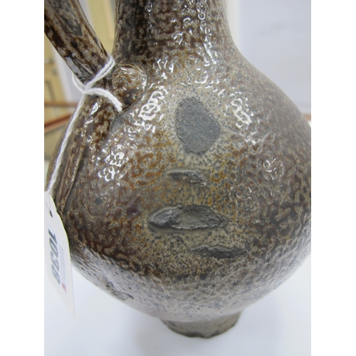 1038 - A German Salt Glazed Bellarmine Jug, moulded with stylised floral roundel and mask face to the neck,... 