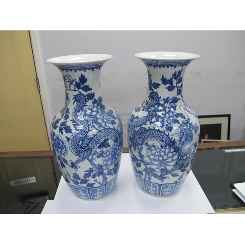 1089 - A Pair of Late XIX Century Chinese Pottery Vases, of baluster form, painted in blue with dragons ent... 