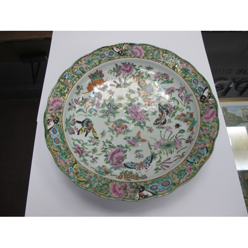 1092 - A Late XIX/Early XX Century Canton Famille Rose Dish, of shaped circular form, colourfully decorated... 