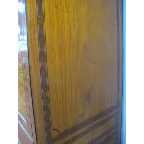 1490 - An Early XX Century Satinwood Two Door Wardrobe, with a stepped cornice, Greek key frieze, crossband... 