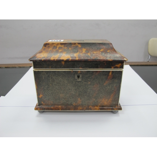 1134 - A Regency Tortoiseshell Tea Caddy, of sarcophagus form raised on bun feet, the interior with two com... 