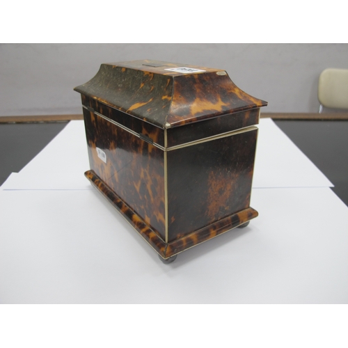 1134 - A Regency Tortoiseshell Tea Caddy, of sarcophagus form raised on bun feet, the interior with two com... 