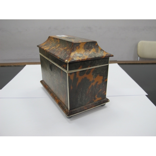 1134 - A Regency Tortoiseshell Tea Caddy, of sarcophagus form raised on bun feet, the interior with two com... 