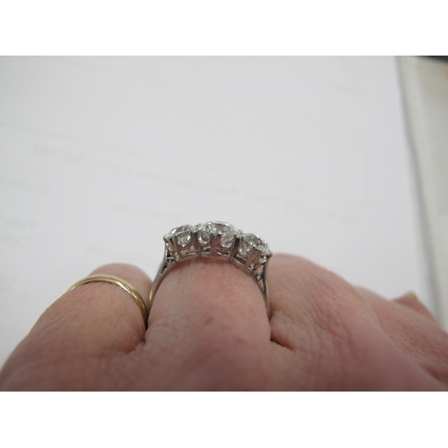 187 - A Large Three Stone Diamond Ring, the graduated old cut stones claw set, stamped 