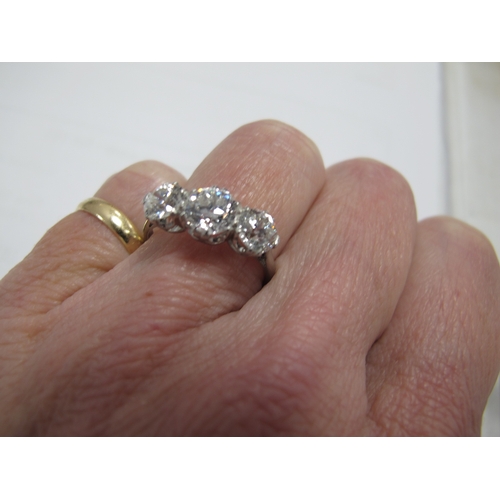 187 - A Large Three Stone Diamond Ring, the graduated old cut stones claw set, stamped 