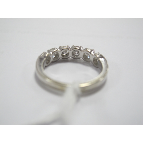 190 - A Modern 18ct White Gold Six Stone Diamond Half Eternity Style Ring, set throughout with uniform bri... 