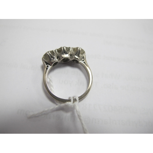 218 - A Large Three Stone Diamond Ring, the brilliant cut stones claw set, stamped 