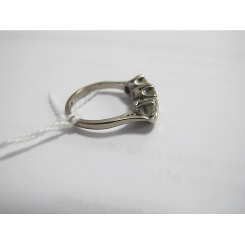 218 - A Large Three Stone Diamond Ring, the brilliant cut stones claw set, stamped 