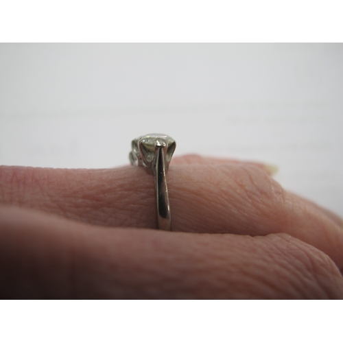 218 - A Large Three Stone Diamond Ring, the brilliant cut stones claw set, stamped 