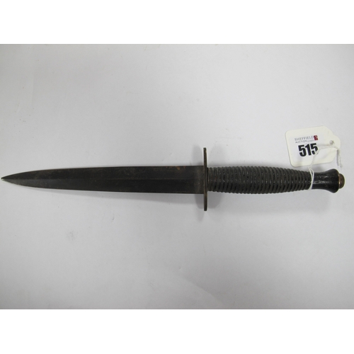 515 - A British Army Fairbairn Sykes Commando Style fighting Knife, with leather scabbard. (Buyer to fully... 