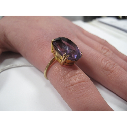 168 - A Large Amethyst Single Stone Dress Ring, oval claw set (finger size P1/2) (6grams).