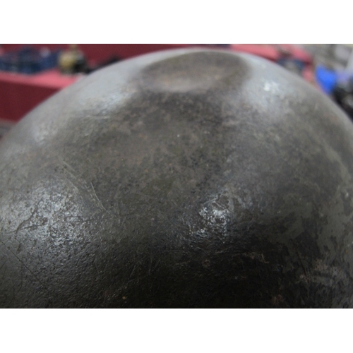 552 - A WWII American M1 Steel Combat Helmet,  with textured paint finish, some indentations to helmet she... 