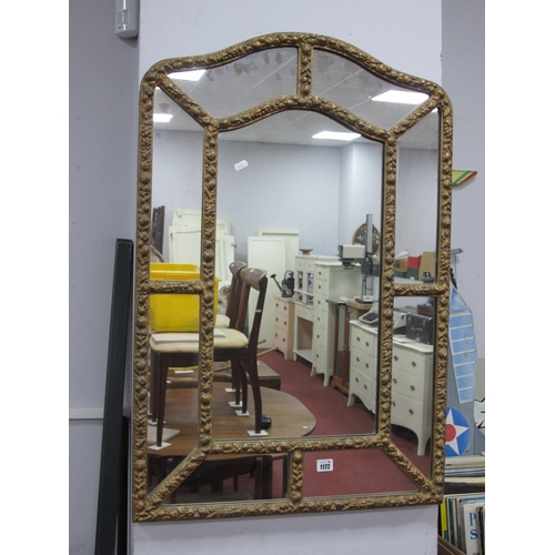 1172 - A Gilt Framed Wall Mirror, with wavy top and sectioned interior, allover applied decoration 60.5cm w... 