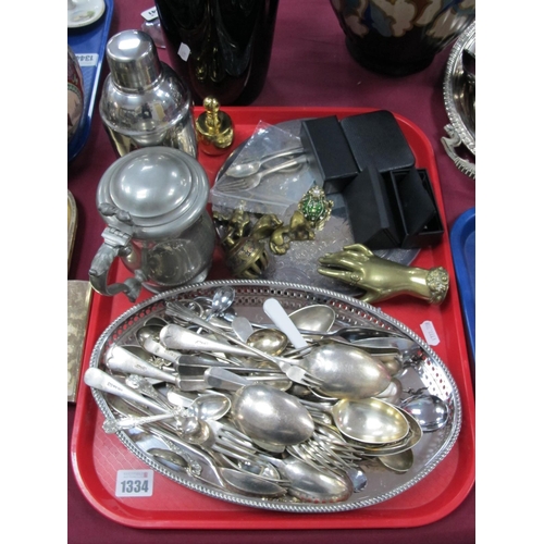 1334 - Silver Medallion and Three Pieces of Cutlery, plated cutlery, brass hand paperweight, cuff links, et... 