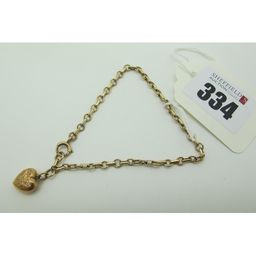 334 - A 9ct Gold Bracelet, suspending a heart charm pendant.