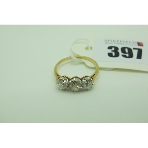 397 - A Three Stone Diamond Ring, the old cut stones claw set (indistinctly stamped / rubbed) (finger size... 