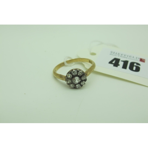 416 - An Antique Diamond Cluster Ring, of flowerhead design, set with graduated old cut stones, stamped 