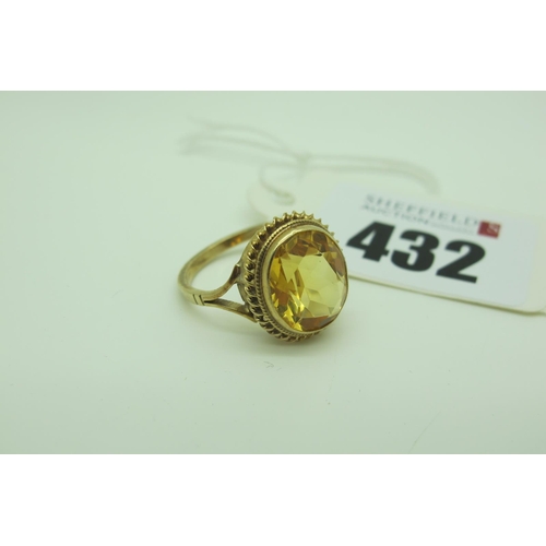 432 - A 9ct Gold Dress Ring, with oval collet set centre, within rope twist border, between bifurcated shu... 