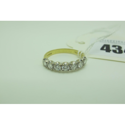 434 - An 18ct Gold Half Eternity Style Ring, with claw set uniform stones between plain shoulders (finger ... 