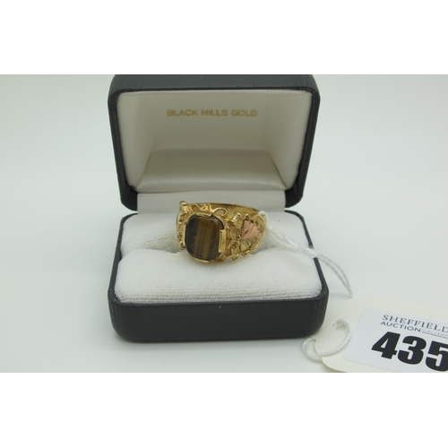 435 - A Modern QVC 9ct Gold Tiger's Eye Inset Ring, of textured design (finger size V) (6.5grams).