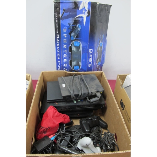 743 - A Quantity of Sony Playstation Consoles and Peripherals, to include four PS2 consoles, controllers, ... 