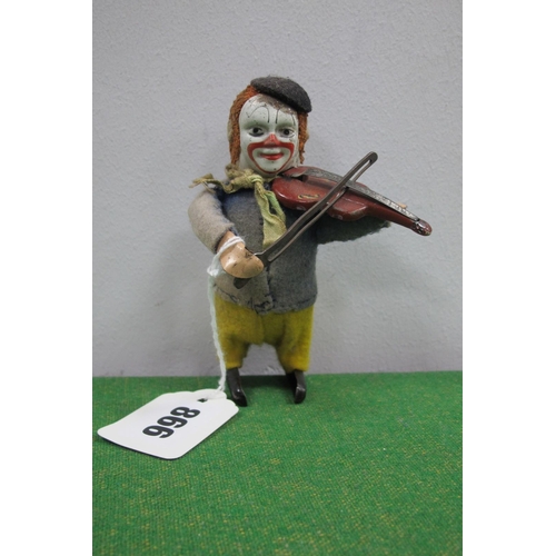866 - A Circa 1930's Schuco Wind Up Clown, playing a violin, (no key), untested, signs of wear.