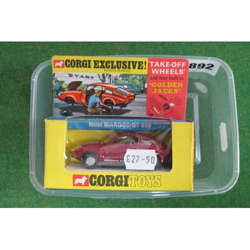 892 - A Boxed Corgi Toys Exclusive #341 Mini Marcos GT850, metallic maroon body, cream seats, take off whe... 