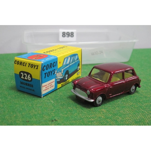 898 - A Boxed Corgi Toys #226 Diecast Model Morris Mini-Minor, metallic maroon body, lemon interior, Corgi... 