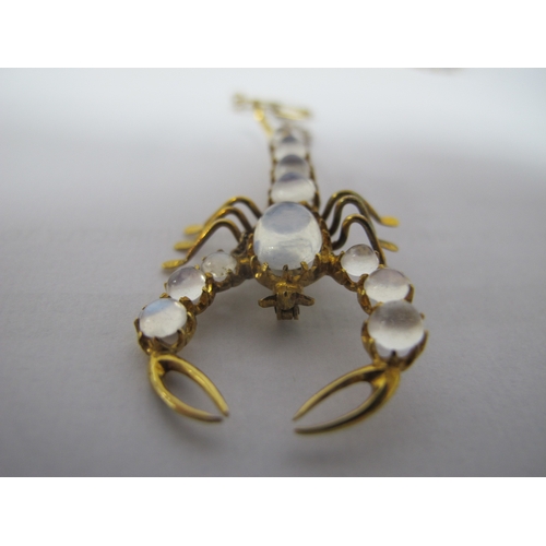 306 - A Novelty Moonstone Inset Scorpion Brooch, graduated circular and oval claw set, approximately 5.5cm... 