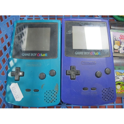 727 - Two Nintendo Gameboy Colour Hand Held Gaming Consoles, (purple boxed  teal - unboxed), battery corro... 