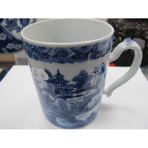 1208 - A Chinese XIX Century Porcelain Tankard, painted in blue with a Chinoiserie river landscape,12cm hig... 