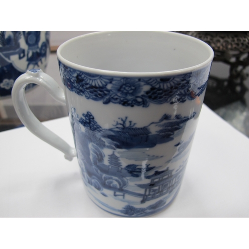 1208 - A Chinese XIX Century Porcelain Tankard, painted in blue with a Chinoiserie river landscape,12cm hig... 