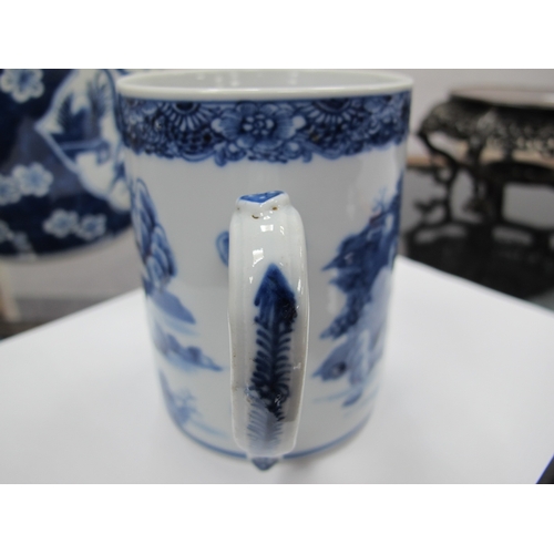 1208 - A Chinese XIX Century Porcelain Tankard, painted in blue with a Chinoiserie river landscape,12cm hig... 