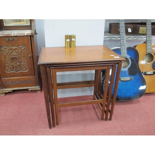 1572 - Nest of Teak Wood Tables, with crossbanded tops and circular tapering legs, 55cm wide.